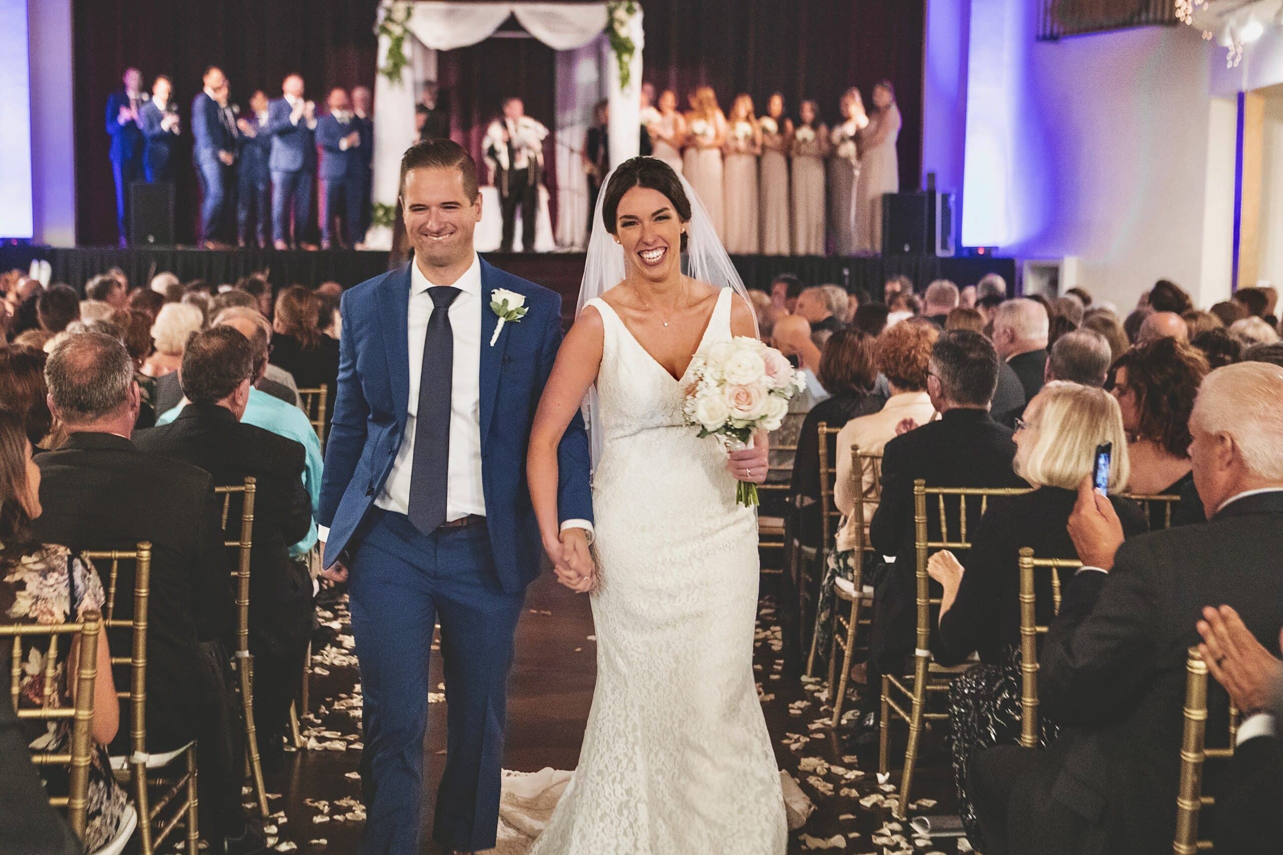 Madrid Theatre wedding reception with gold Chiavari chairs and ornate 1920s movie palace interior in Kansas City